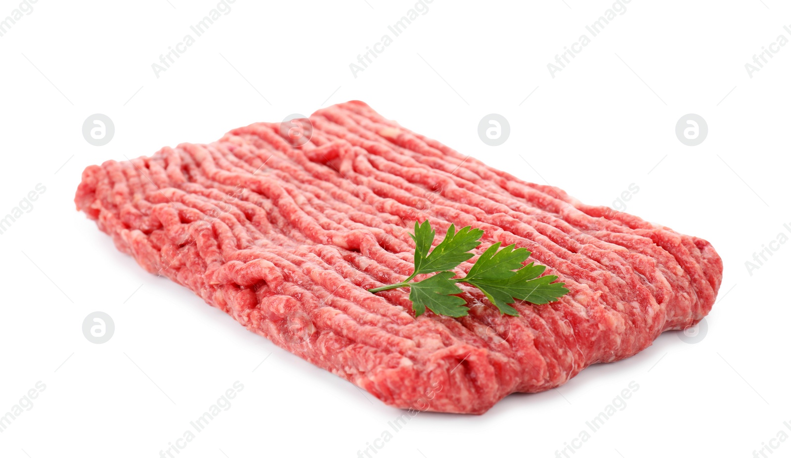 Photo of Raw ground meat and parsley isolated on white