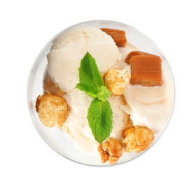 Delicious ice cream with caramel candies and popcorn in dessert bowl on white background, top view