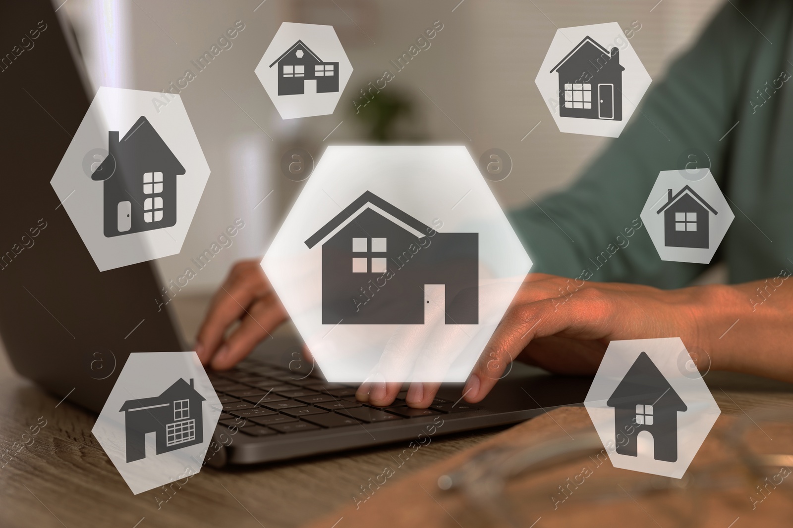 Image of House search. Man choosing home via laptop at table, closeup. Illustrations of different buildings as real estate variations