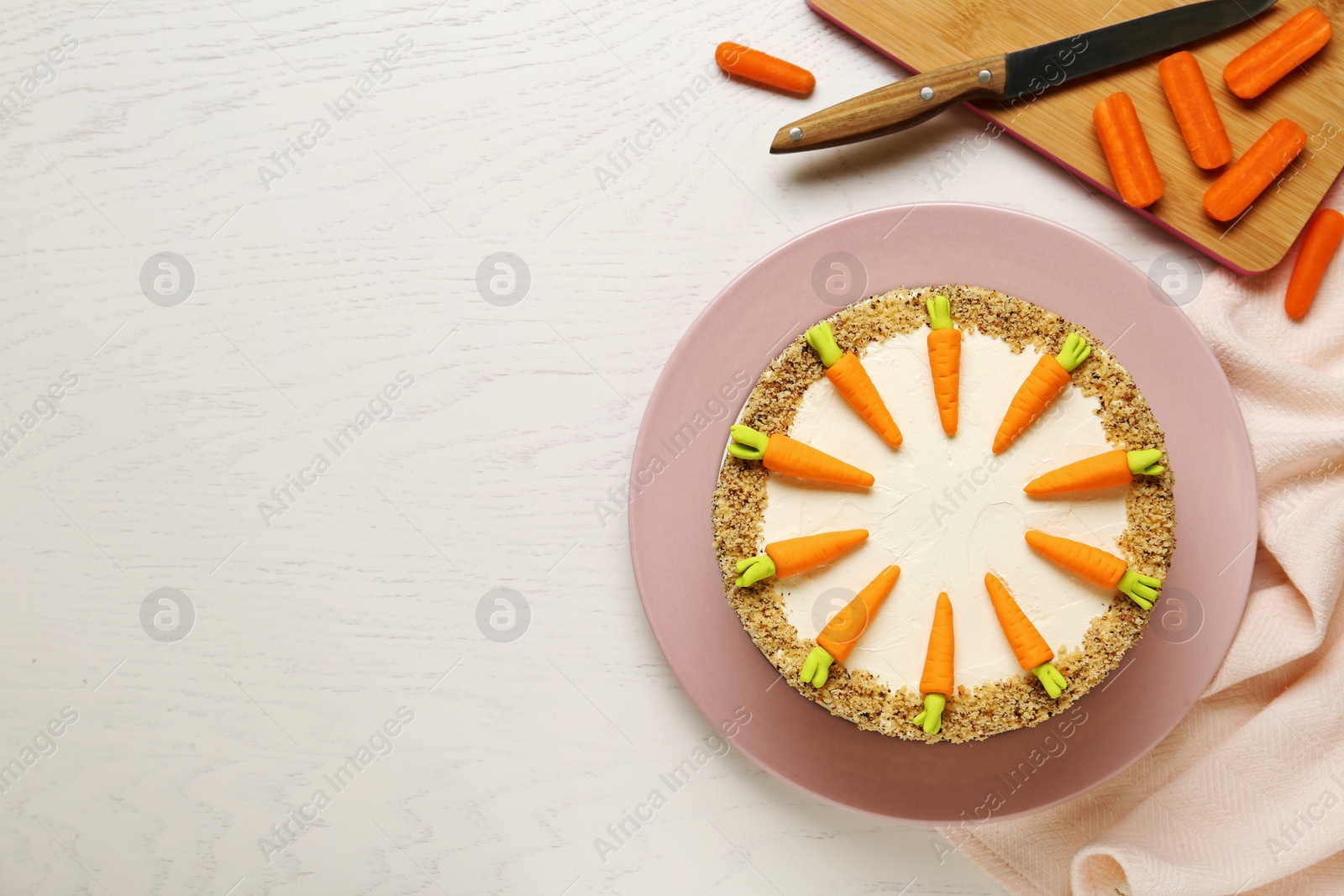 Photo of Flat lay composition with tasty carrot cake on white wooden table, space for text