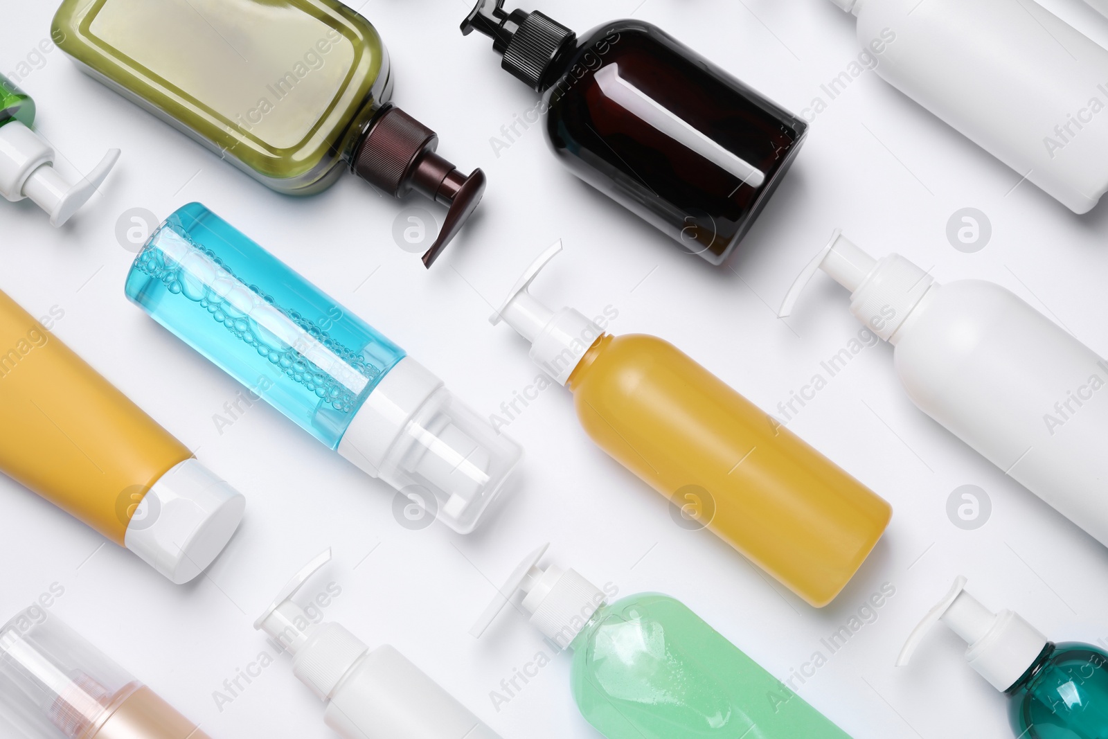 Photo of Different cleansers on white background, flat lay. Cosmetic product