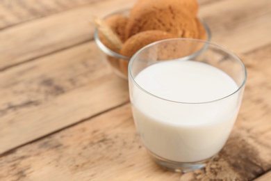 Photo of Glass of milk on wooden table. Fresh dairy product