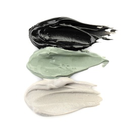 Photo of Different professional face mask smears on white background