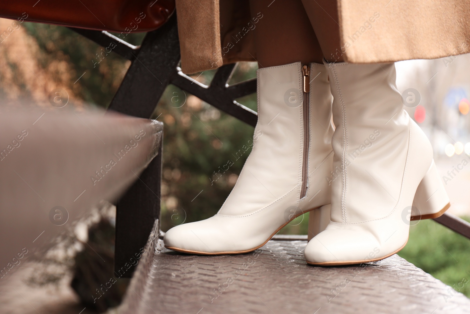 Photo of Woman wearing stylish leather shoes on stairs outdoors, closeup
