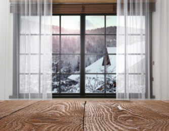 Image of Empty wooden table and window with beautiful view indoors