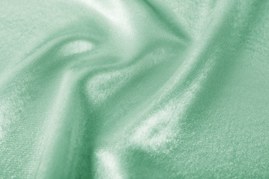 Texture of beautiful silk as background. Image toned in mint color 