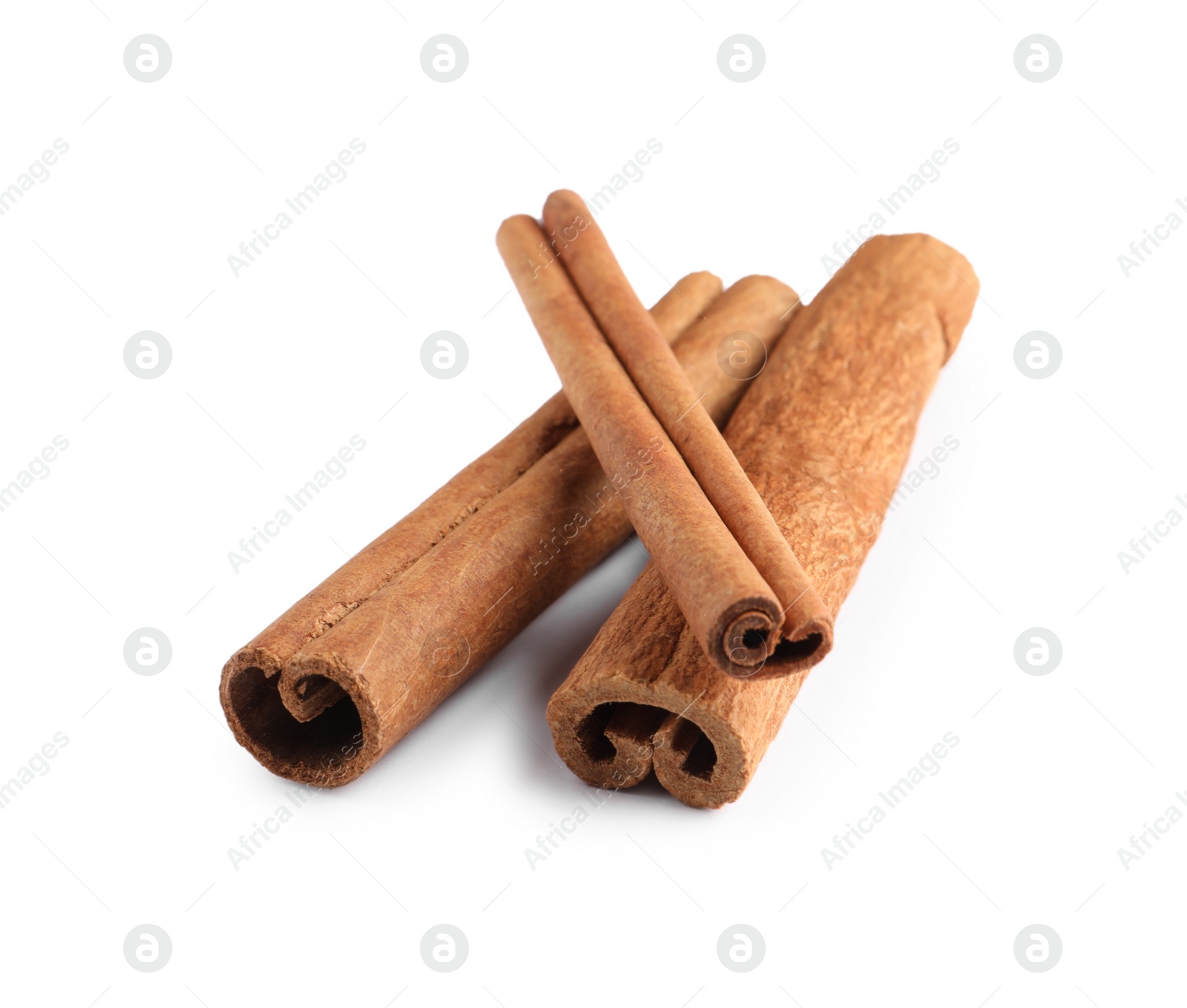 Photo of Three aromatic cinnamon sticks isolated on white