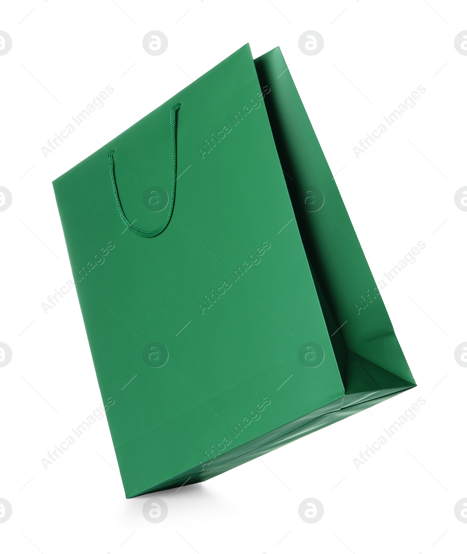 Photo of One green shopping bag isolated on white