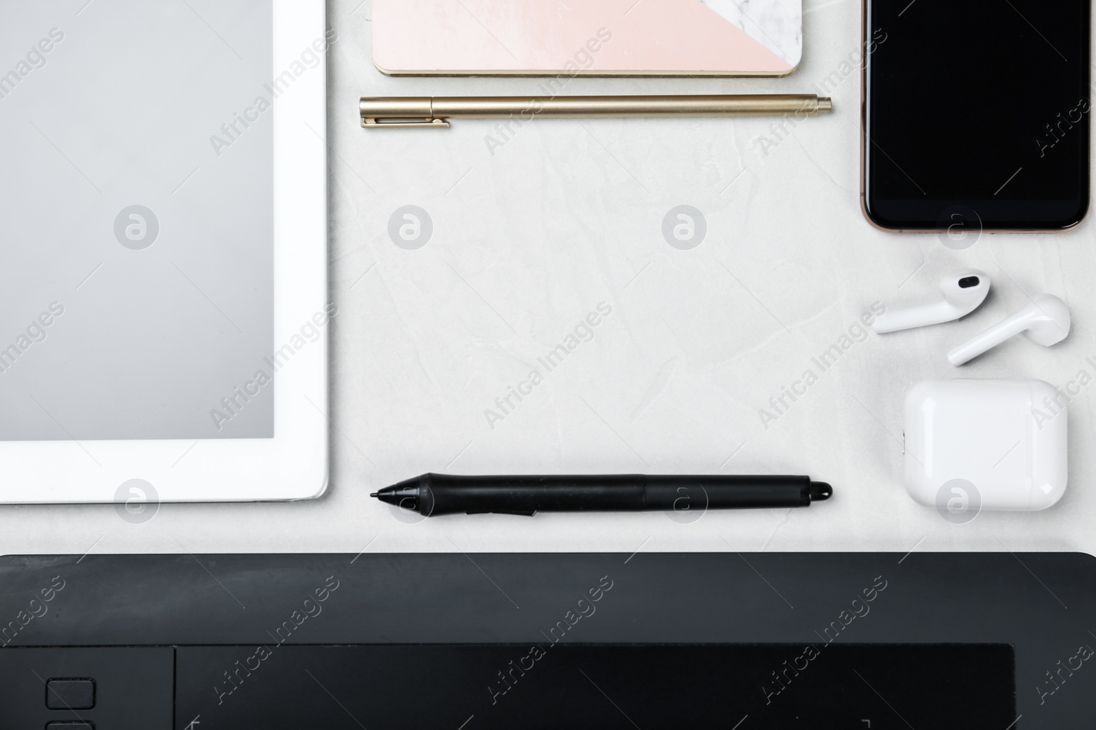 Photo of Flat lay composition with digital devices and notebook on white background, space for text. Graphic designer's workplace