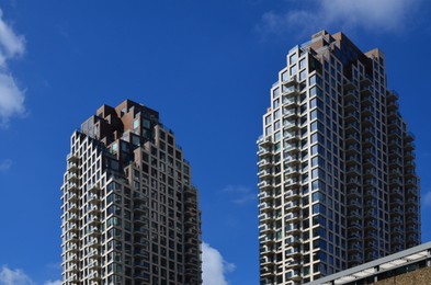 Exterior of beautiful buildings against blue sky, low angle view