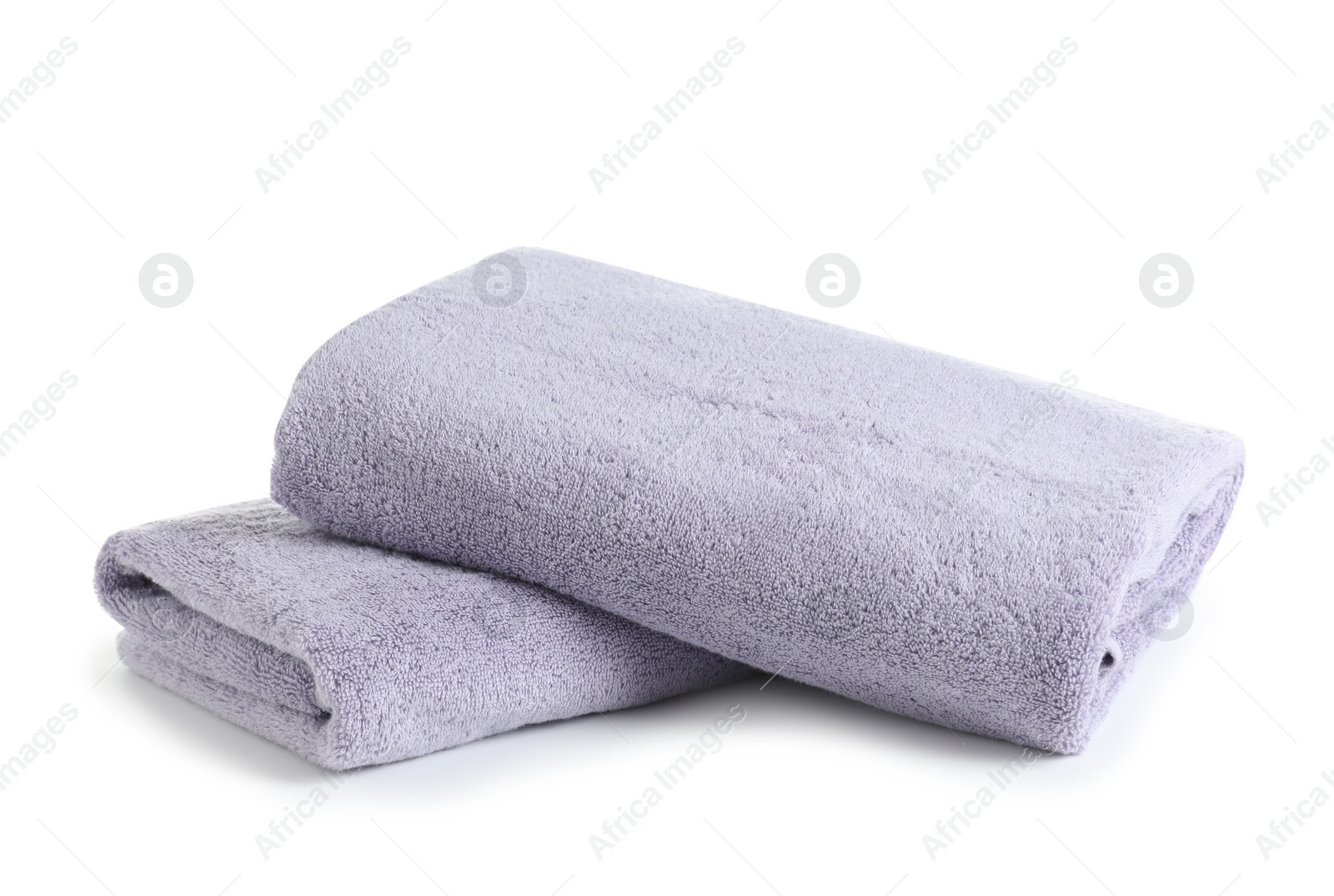 Photo of Fresh soft folded towels isolated on white