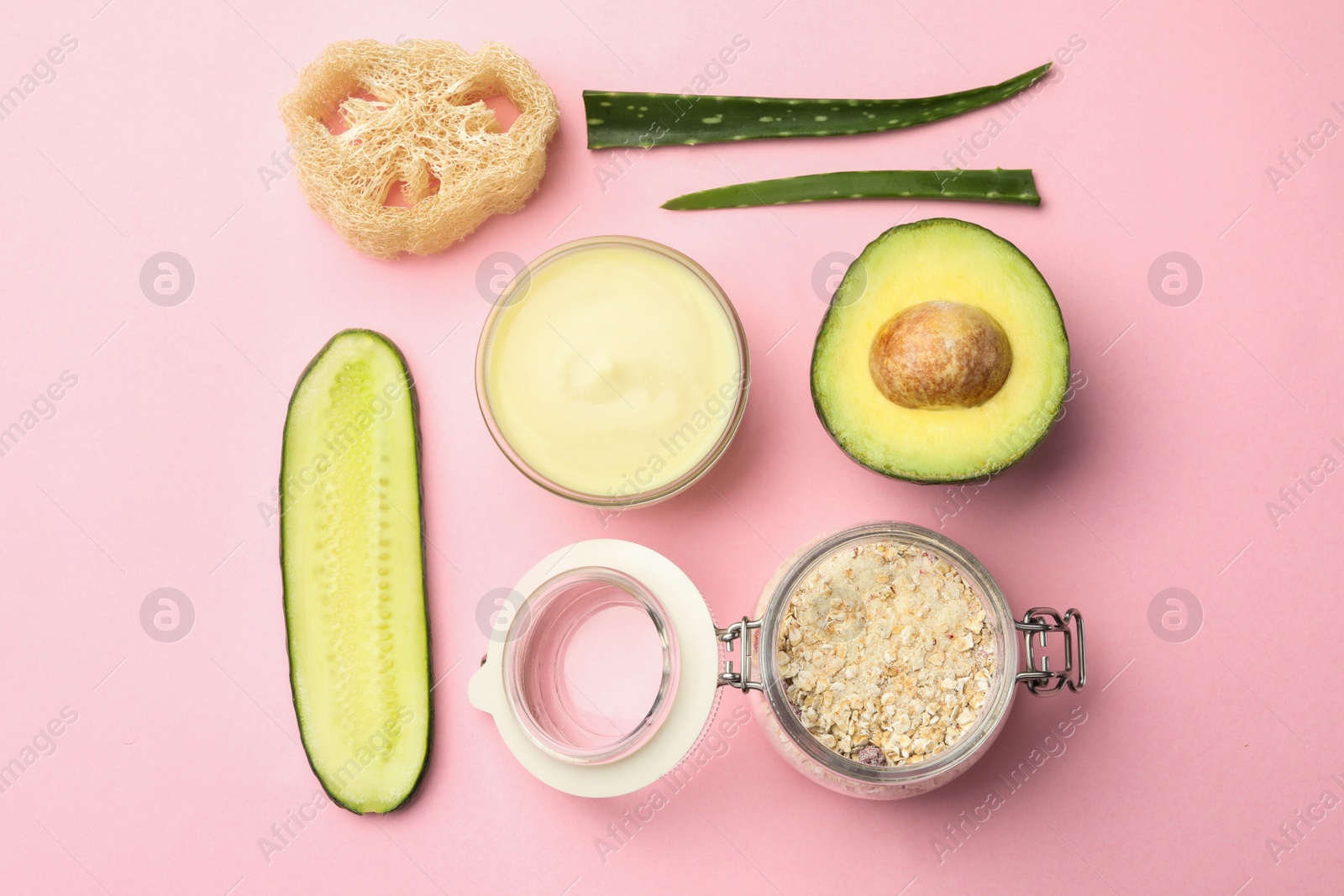 Photo of Flat lay composition with handmade face mask and ingredients on pink background