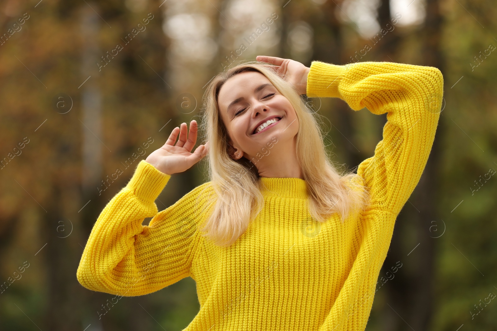 Photo of Autumn vibes. Portrait of happy woman outdoors