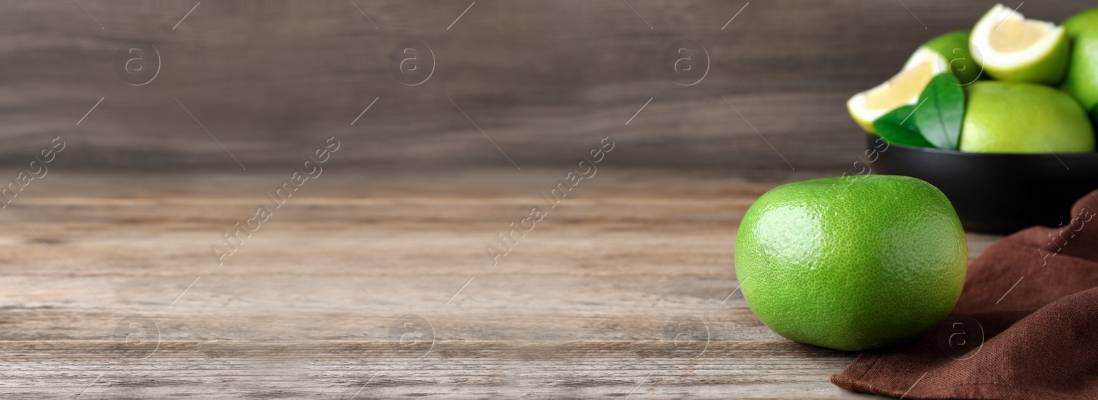 Image of Fresh ripe sweetie fruit on wooden table, space for text. Banner design
