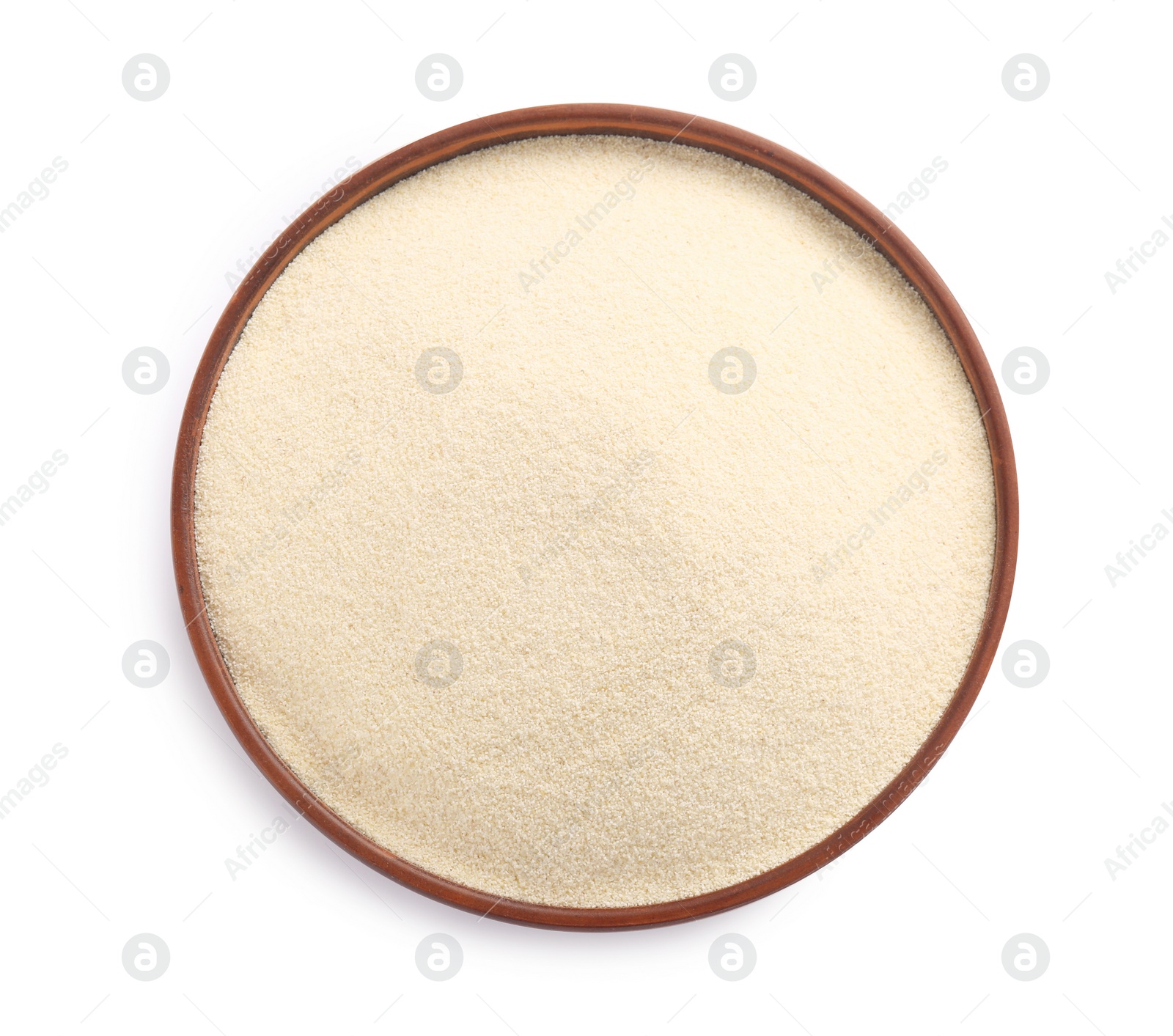 Photo of Bowl of uncooked organic semolina isolated on white, top view