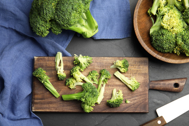 Photo of Flat lay composition with fresh broccoli on black table