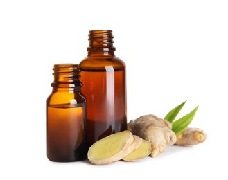 Glass bottles of essential oil and ginger root on white background