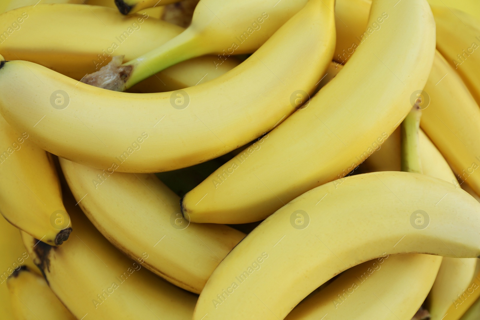 Photo of Many tasty bananas as background, closeup view