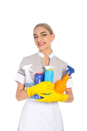 Young chambermaid with detergents on white background