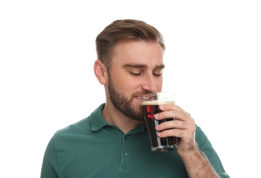 Handsome man with cold kvass on white background. Traditional Russian summer drink