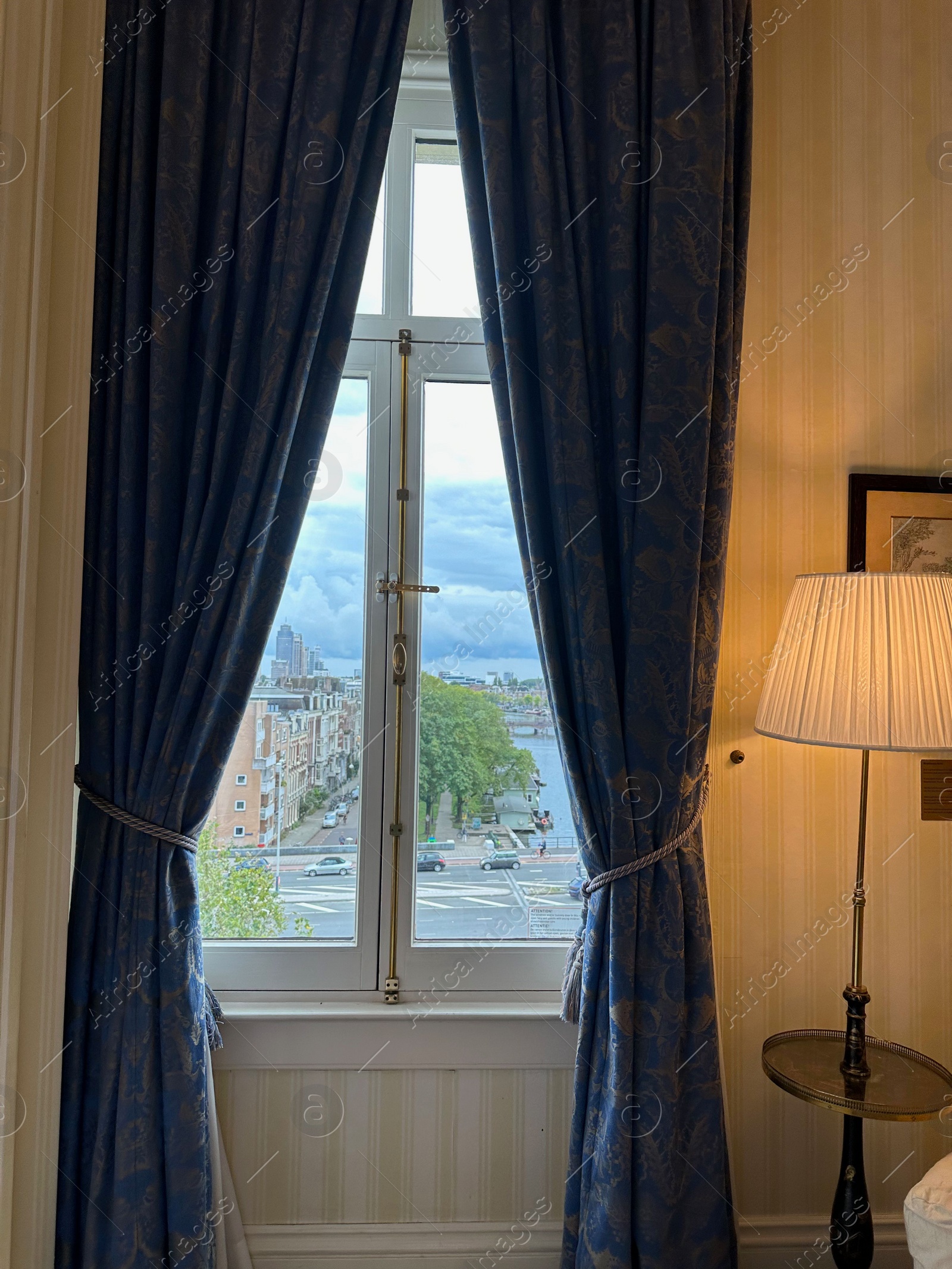 Photo of Amterdam, Netherlands - September 22, 2023: Beautiful view on city through Amstel Hotel window