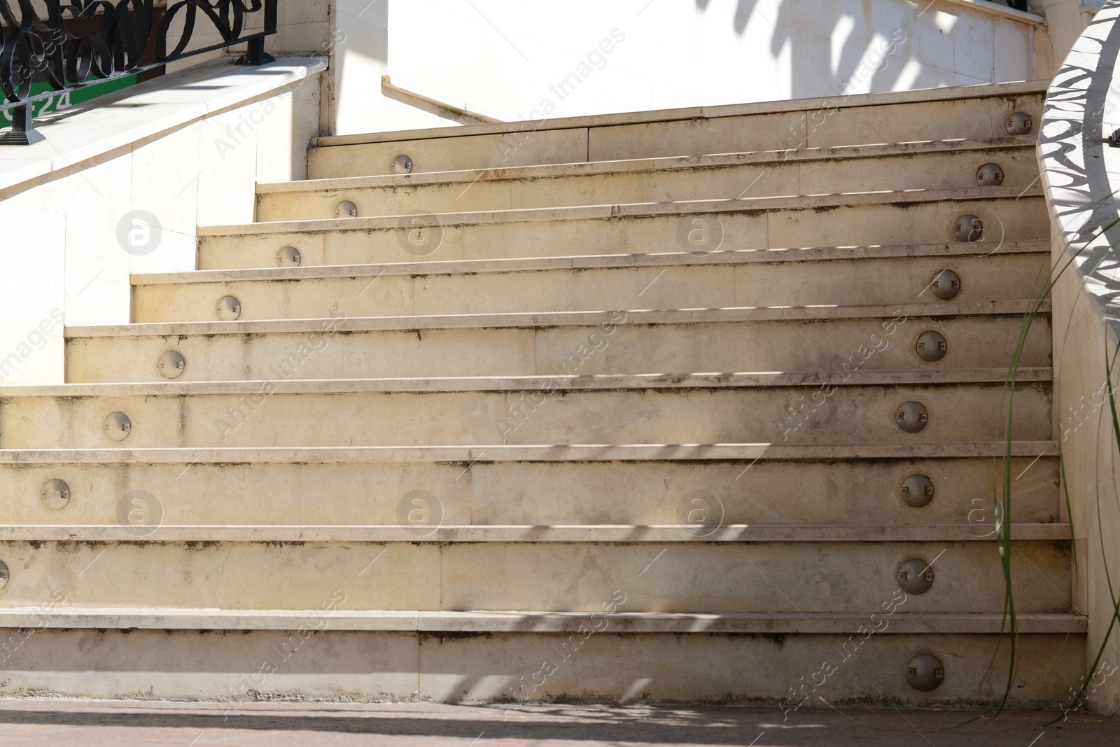 Photo of Staircase covered with tiles outdoors on sunny day