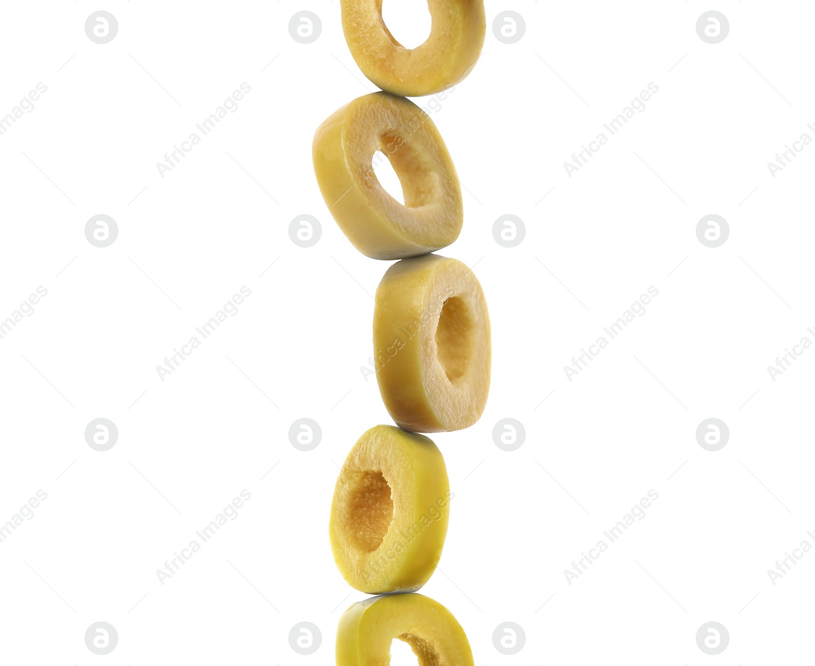 Image of Stacked slices of green olive on white background