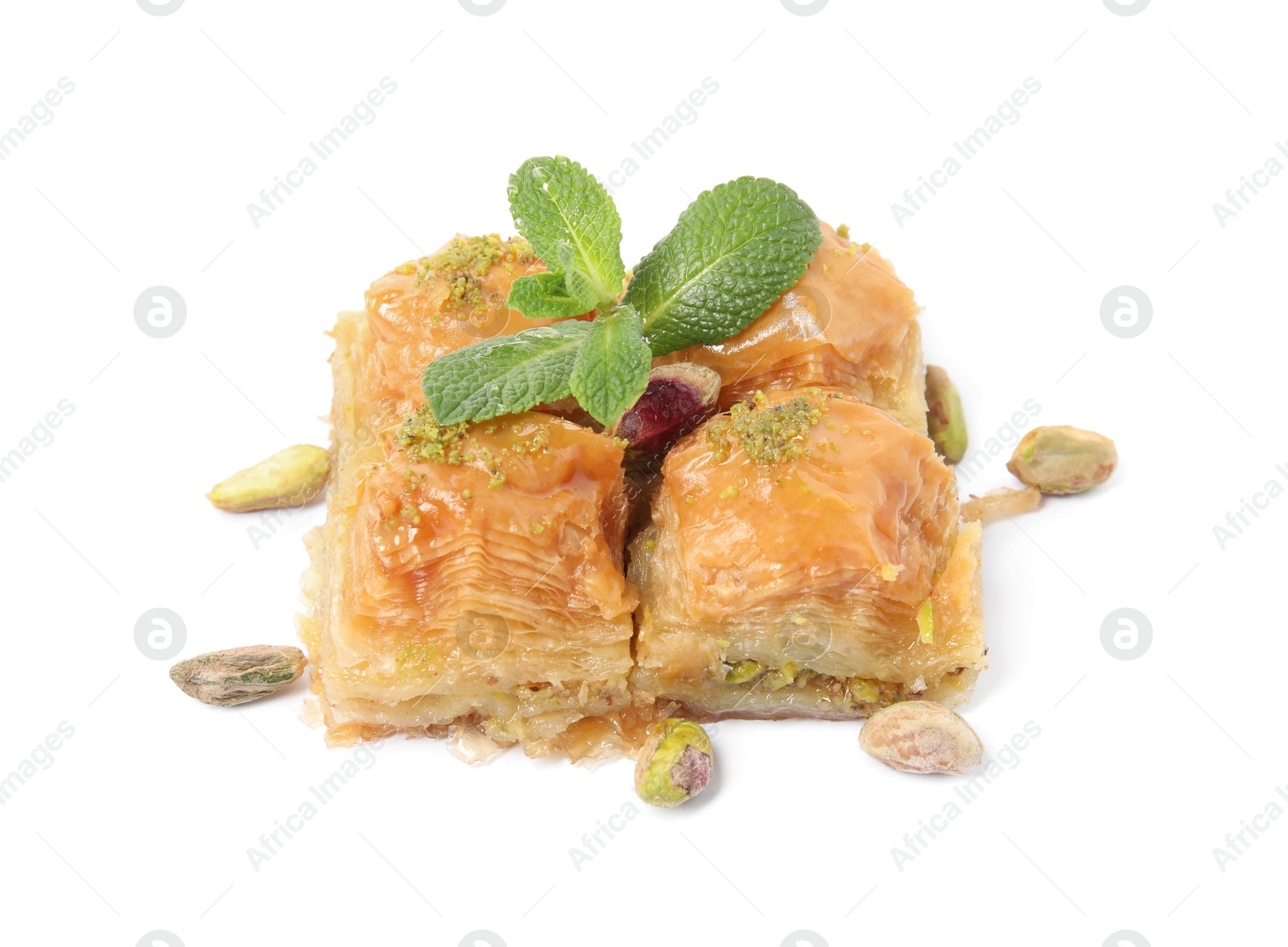 Photo of Delicious baklava with pistachios, mint and scattered nuts on white background