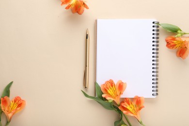 Guest list. Notebook, pen and beautiful flowers on beige background, flat lay. Space for text