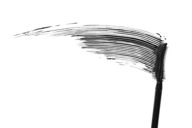 Photo of Smear of black mascara and applicator isolated on white, top view