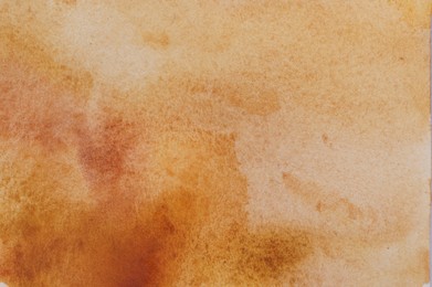 Photo of Abstract orange watercolor painting as background, top view