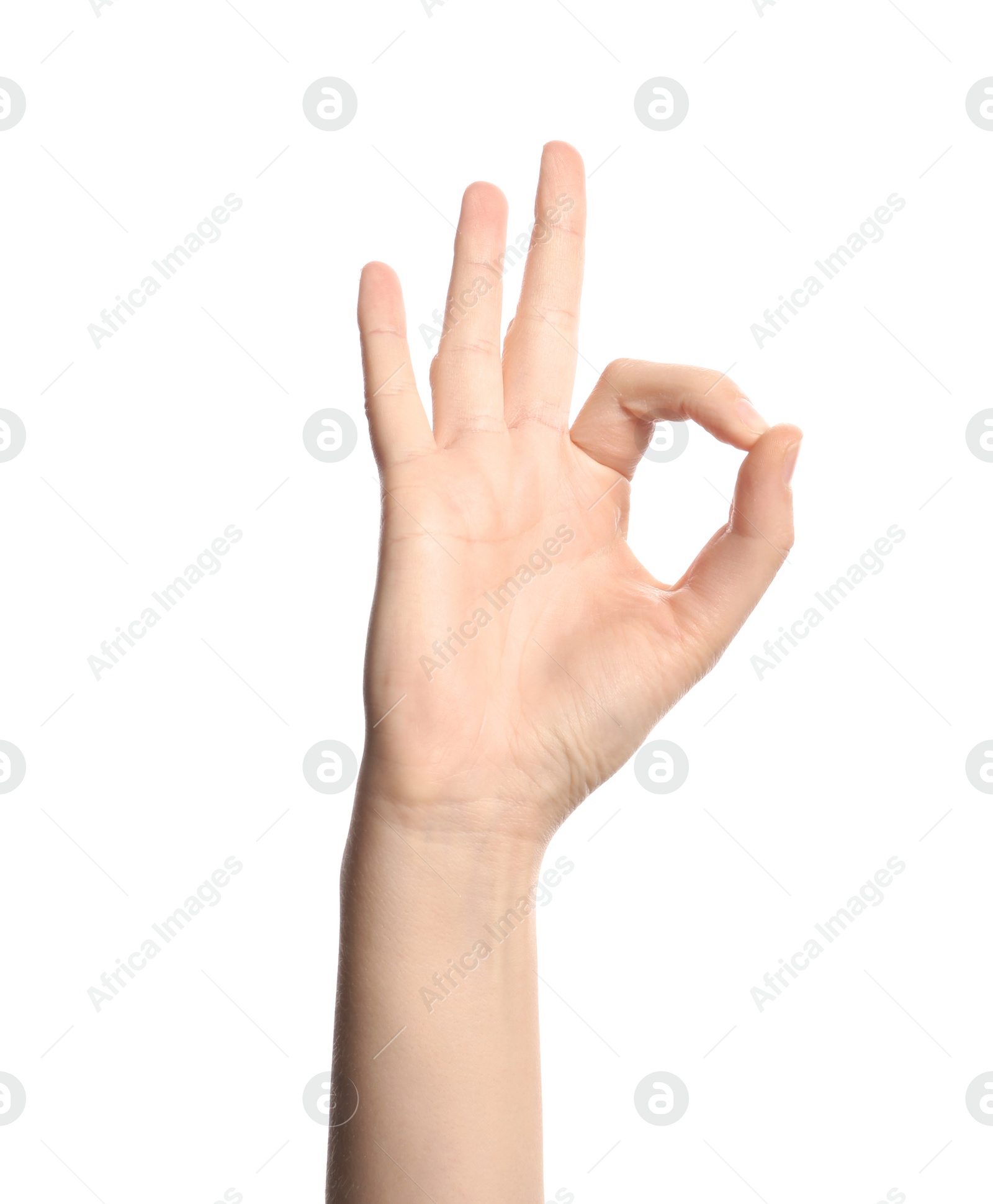 Photo of Young woman showing OK gesture on white background