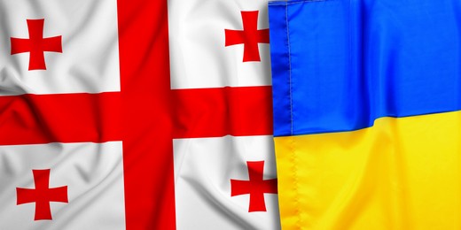 Image of National flags of Ukraine and Georgia as background, banner design