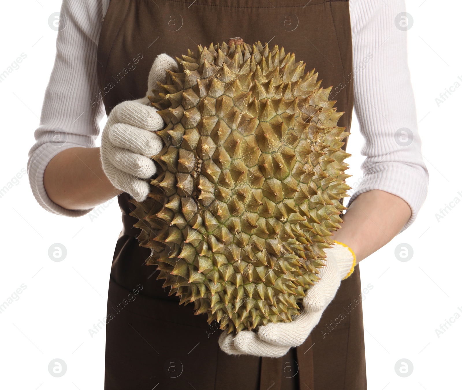 Photo of Woman in gloves holding fresh ripe durian on white background, closeup