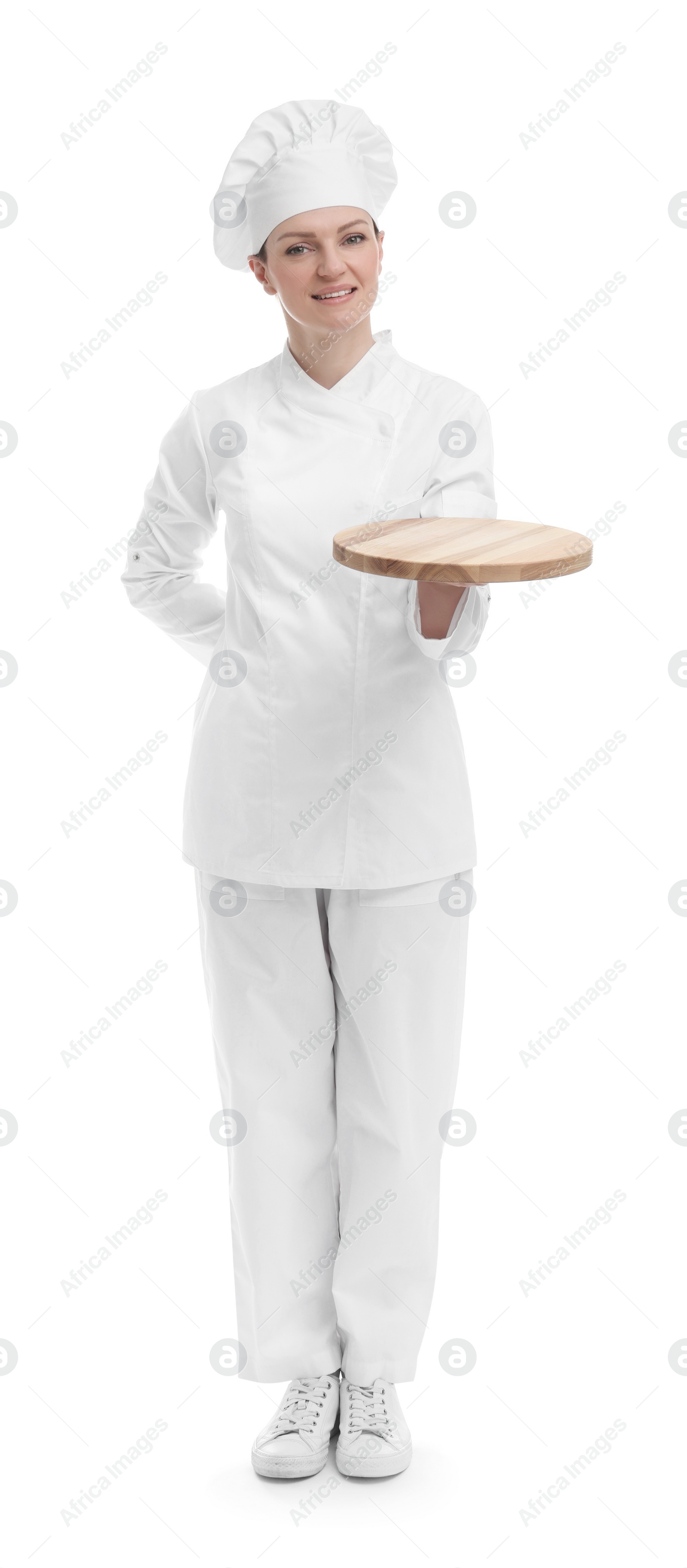 Photo of Happy chef in uniform holding empty wooden board on white background