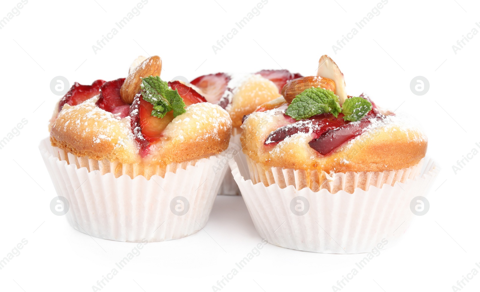 Photo of Delicious cupcakes with plums isolated on white