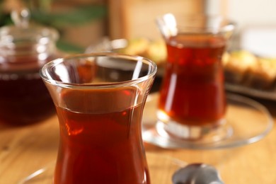 Traditional Turkish tea in glasses on table, closeup