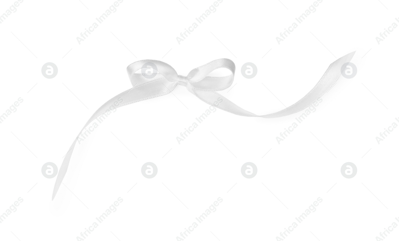 Photo of Satin ribbon tied in bow on white background, top view