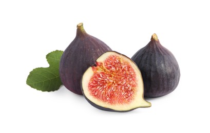 Cut and whole ripe figs isolated on white