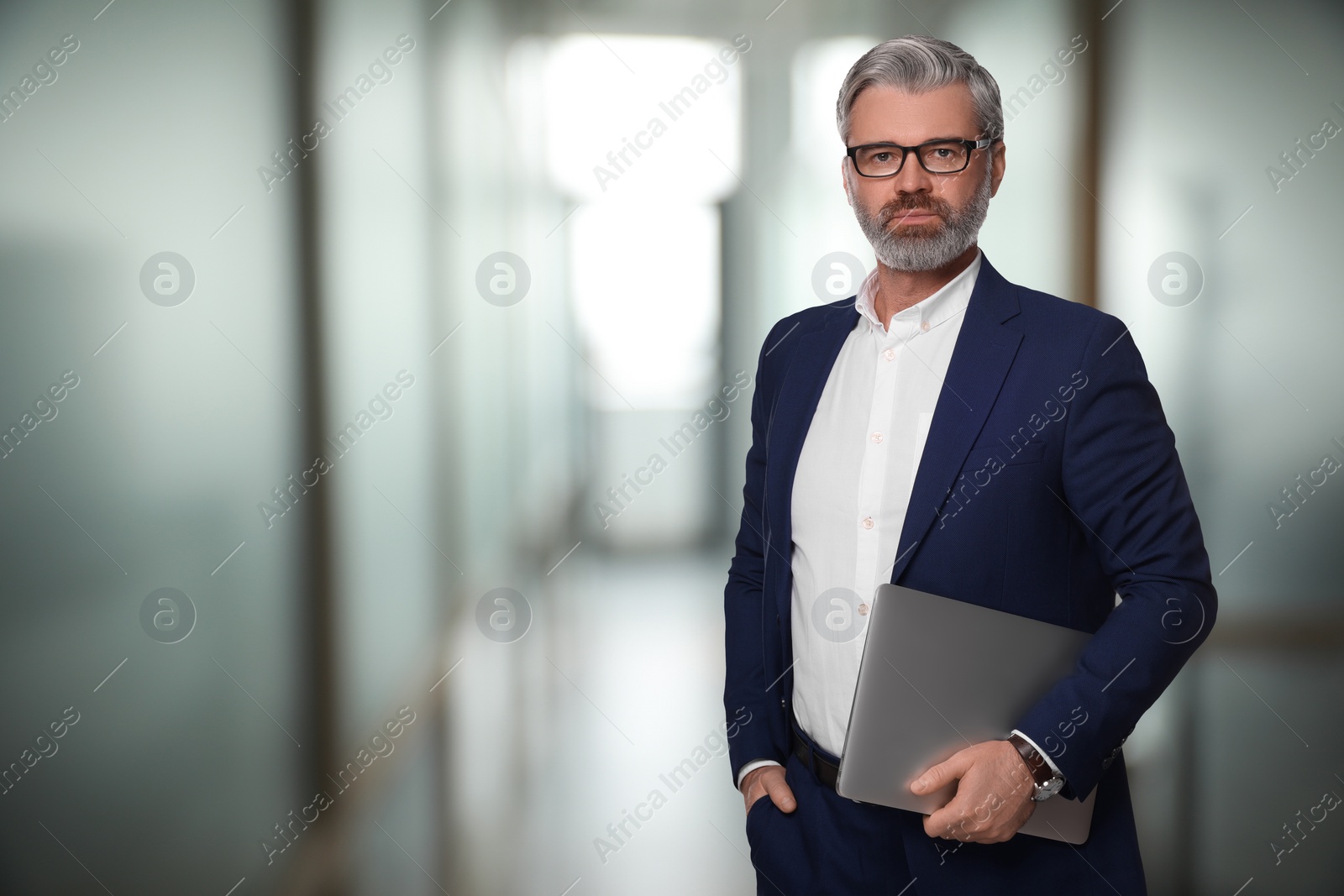 Image of Successful lawyer with laptop on blurred background, space for text