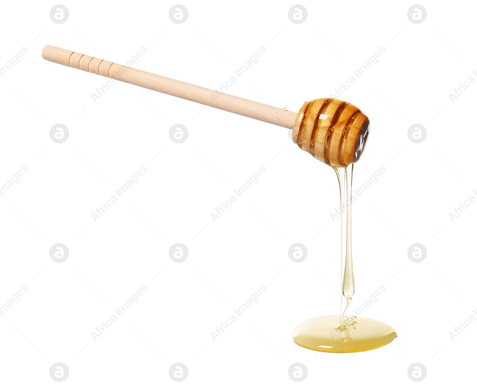 Photo of Natural honey dripping from dipper on white background