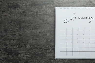 January calendar on grey stone background, top view. Space for text