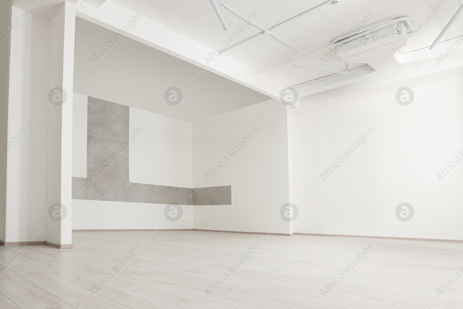 Photo of Empty office room with white walls and ventilation system. Interior design