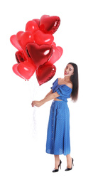 Photo of Beautiful young woman with heart shaped balloons isolated on white. Valentine's day celebration