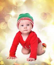 Cute little baby in Santa's elf clothes against blurred festive lights. Christmas celebration