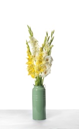 Photo of Vase with beautiful gladiolus flowers on white background