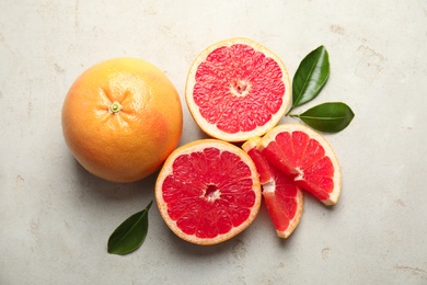 Fresh tasty grapefruits on table, flat lay