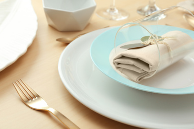 Photo of Elegant table setting with with golden cutlery, closeup