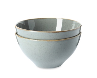 Photo of New grey ceramic bowls on white background