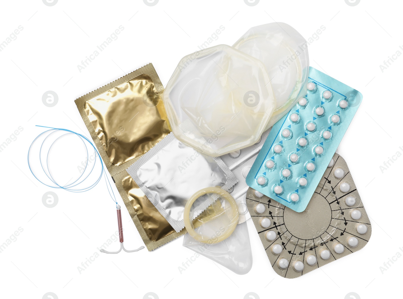 Photo of Contraceptive pills, condoms and intrauterine device isolated on white, top view. Different birth control methods